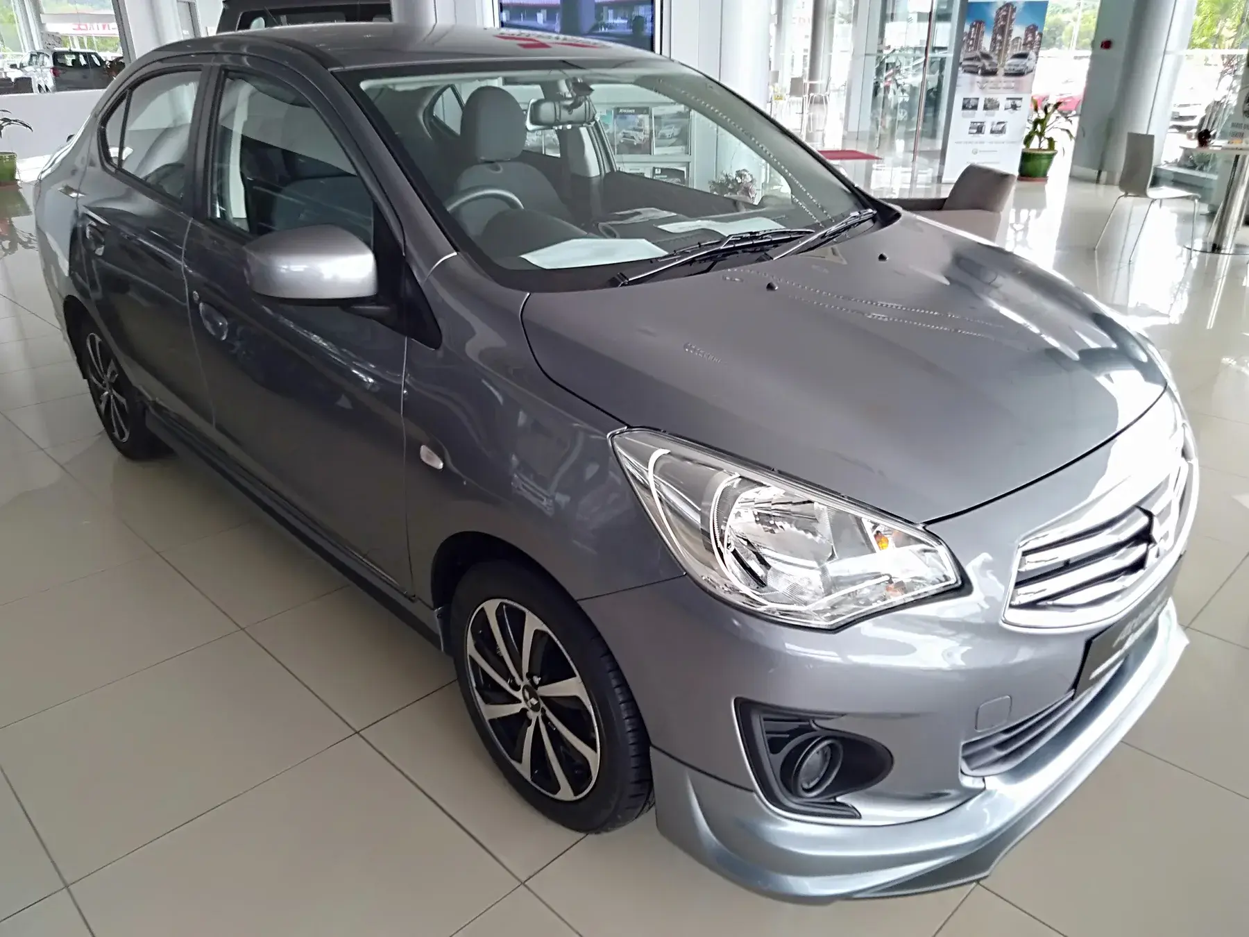 Representative grey Mitsubishi Attrage viewed from the front
