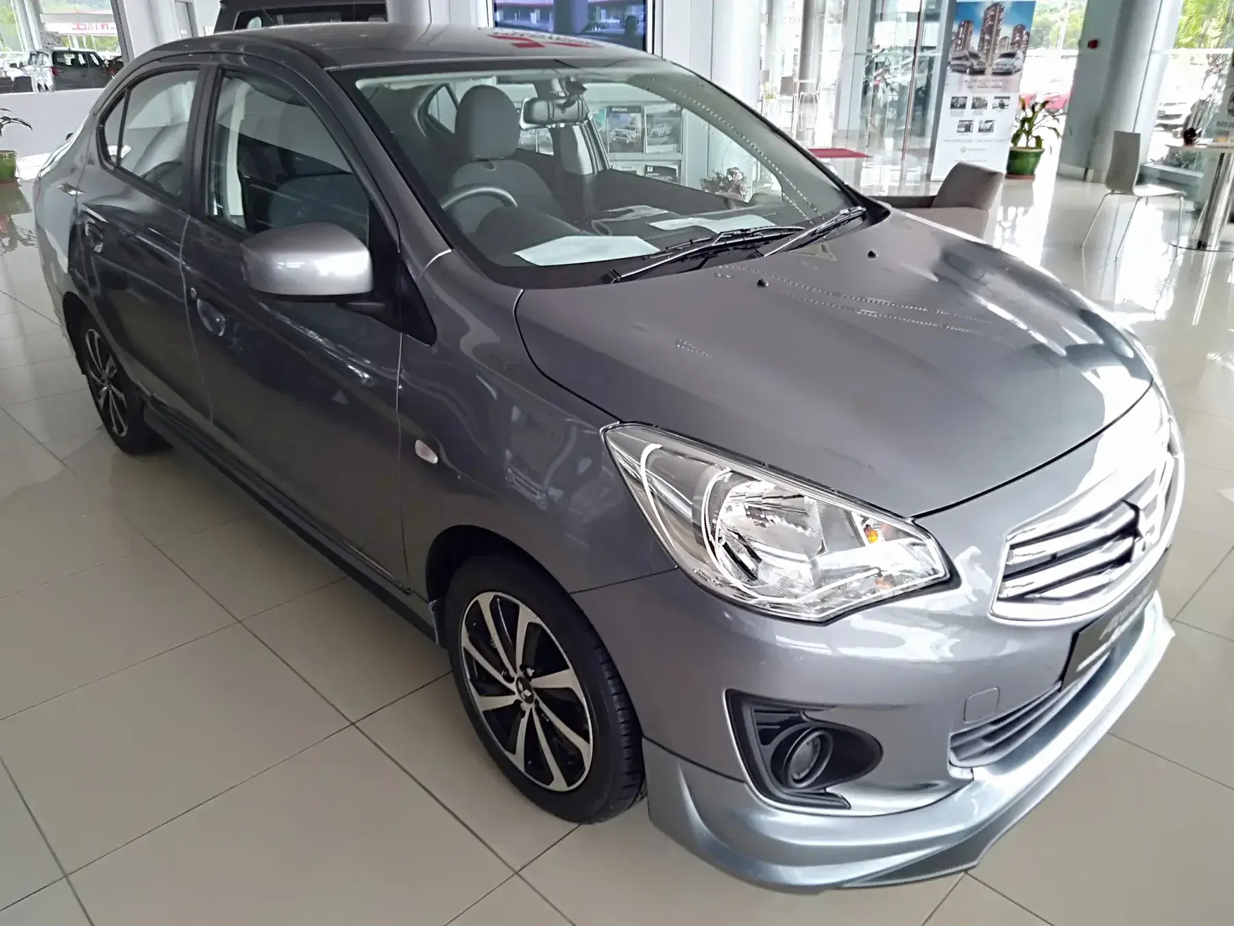 Representative grey Mitsubishi Attrage viewed from the front